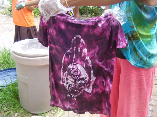 Figure 3: Student proudly displays tie dye design