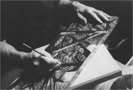 Figure 24: Photograph of Lynd Ward drawing an image in ink